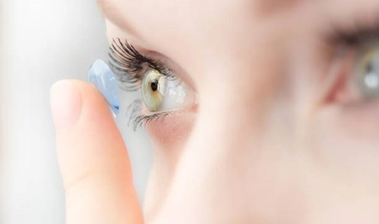 Woman Putting In Contacts